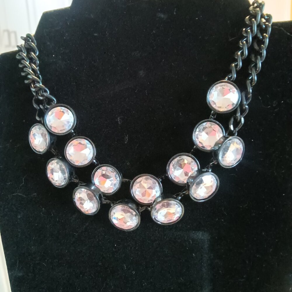 A contemporary necklace and earring set with lots of sparkle!